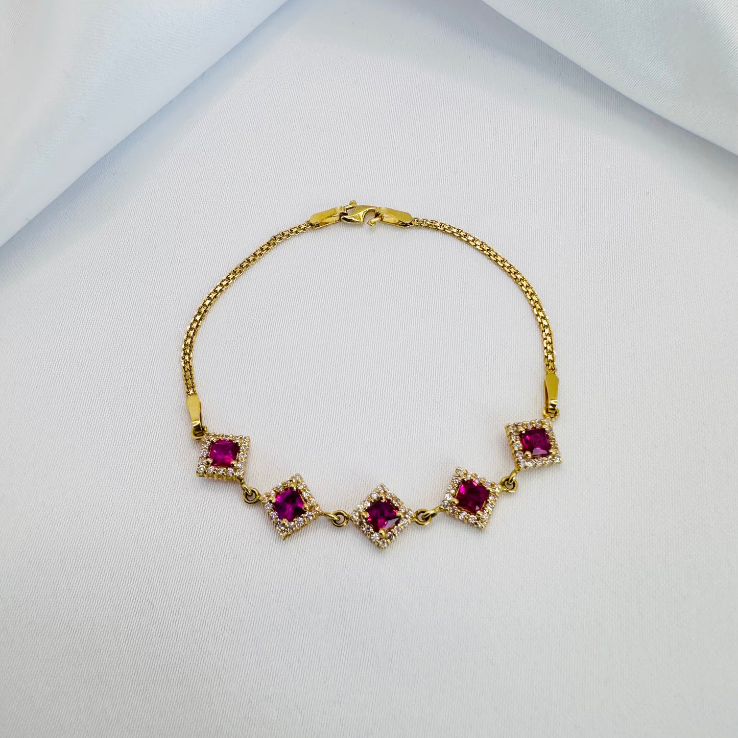 22k solid gold designer bracelet with white and ruby/pink colour CZ