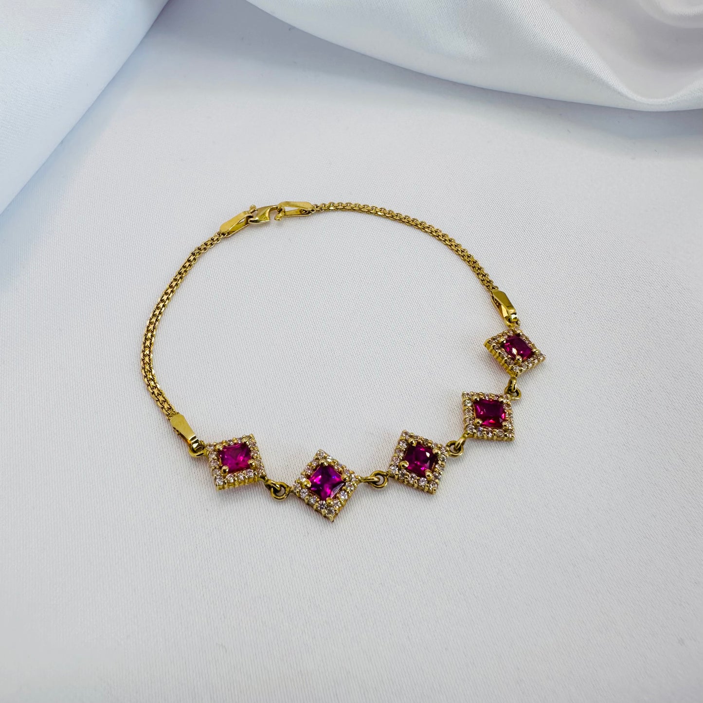 22k solid gold designer bracelet with white and ruby/pink colour CZ